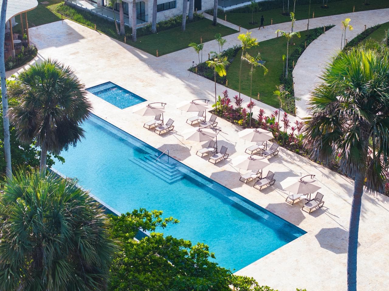 The Wave aerial view — curved beachfront architecture in Cabarete